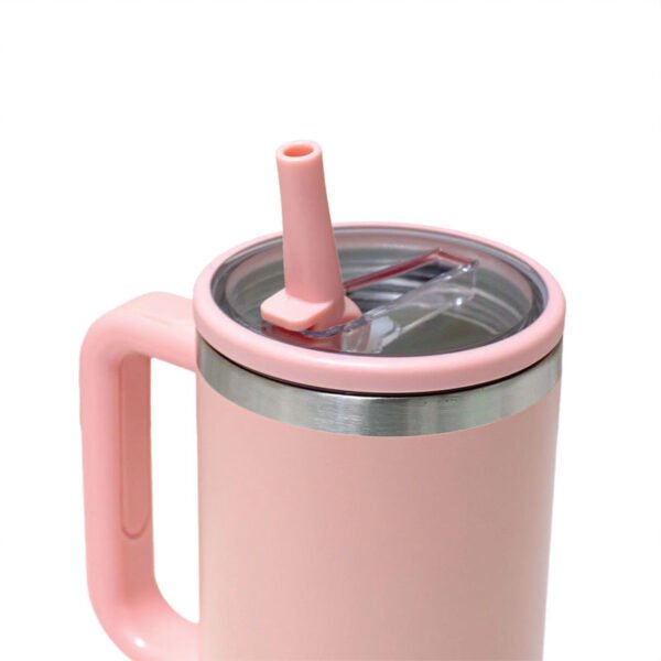 Pink double-walled tumbler with handle and flip straw, reusable travel cup